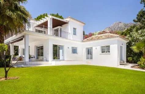 Villa and lawn with mountain views